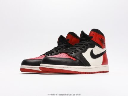 High-top sneaker with a black, white, and red color scheme.