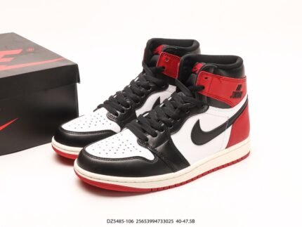 A pair of red, black, and white high-top sneakers next to a black box.