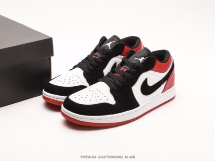 A pair of black, white, and red sports shoes with a red logo on the tongue.