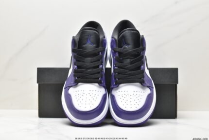 A pair of black, white, and purple sports shoes with a brand logo on the tongue.