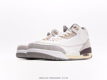 White and gray high-top sneakers with gold details and white laces