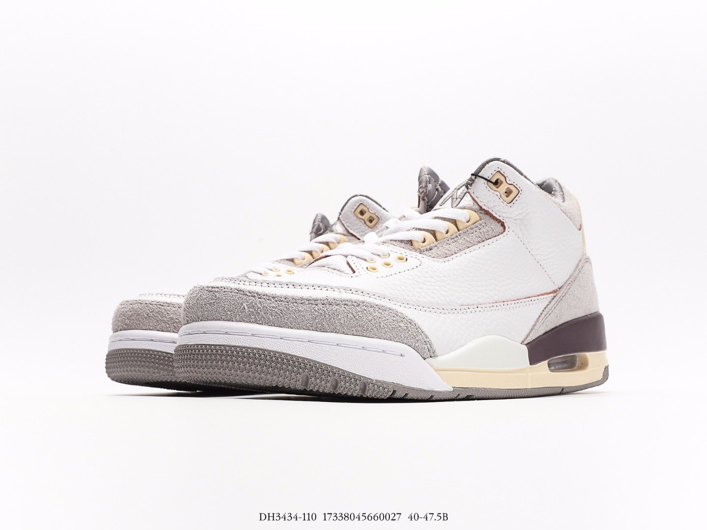 Stylish White High-Top Sneakers with Gray and Gold Accents White and gray high-top sneakers with gold details and white laces