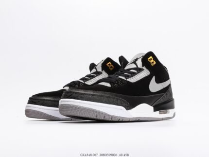 Black and white high-top sports shoes with gold details, white sole