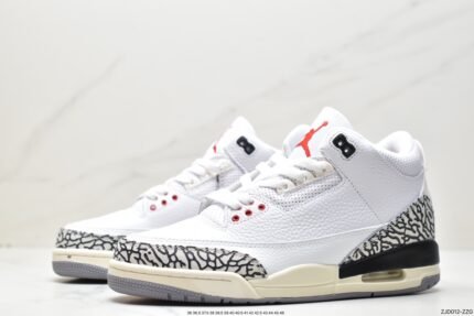 White high-top sneakers with red and black details and gray patterned decorations