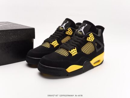 Black sneakers with yellow mesh accents, black shoebox beside