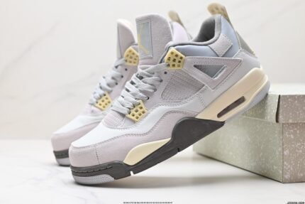 Gray and beige low-top sneakers with yellow details and white laces