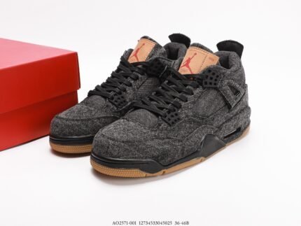 Dark grey sneakers with black laces, brown details, red shoebox beside