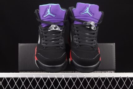 Black sneakers with purple collar, black shoebox