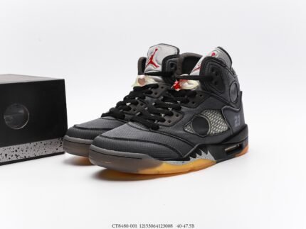 High-top sneakers with a black and grey color scheme and red accents.