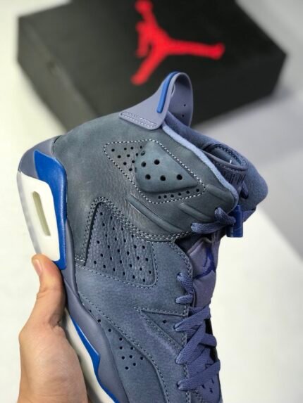 High-top sneaker in navy blue with white and lighter blue accents.