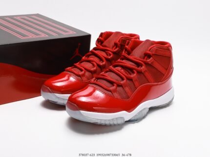 A pair of red high-top sneakers with a smooth upper and a fashionable design.