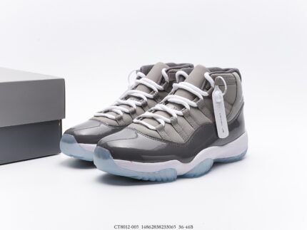 A pair of gray high-top sneakers with a gray shoebox, featuring a transparent sole design.