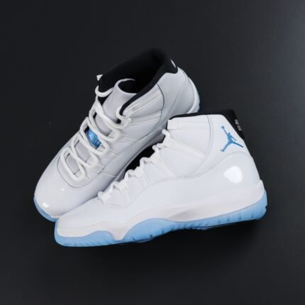 A pair of white high-top sneakers with gray and blue details and a transparent sole.