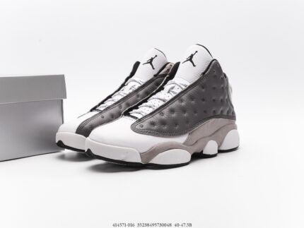 Gray and white sports shoes with black details, white laces