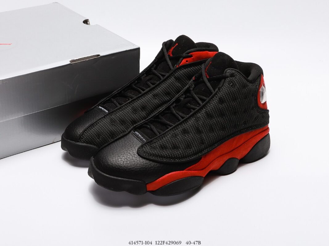 Black sports shoes with red details, black laces