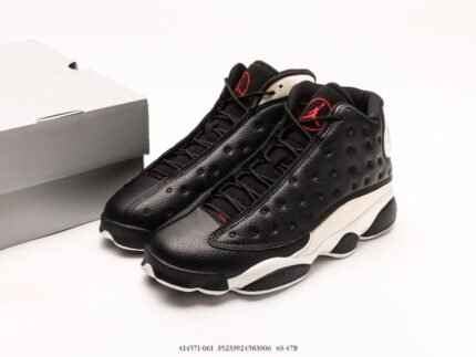 Black and white sports shoes with red details, white shoe box