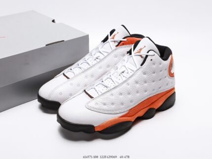 White and orange sports shoes with lace-up closure, gray shoe box