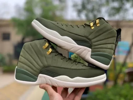 Green high-top sports shoes with white soles, gold details, outdoor background