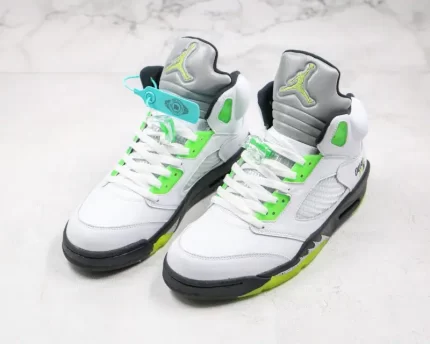 High-top sneakers with a white base color and neon green accents.