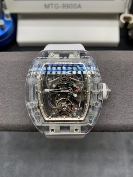 A silver wristwatch with a blue and gold dial on a silver bracelet.