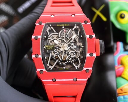 A red wristwatch with a transparent dial showcasing intricate mechanical gears, set against a blurred background of colorful objects.