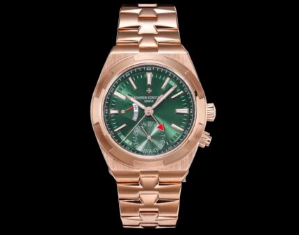 A gold watch with a green dial and a gold bracelet.