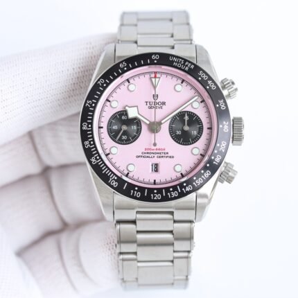 A silver wristwatch with a pink dial and silver bracelet.