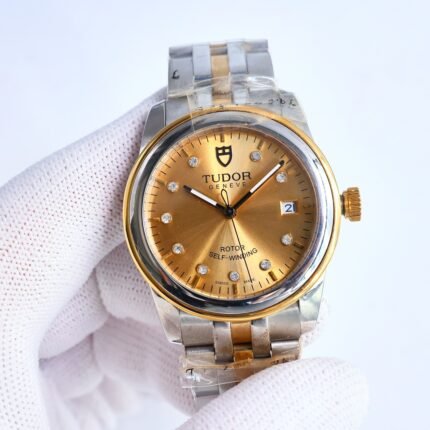 A gold and silver wristwatch with a gold dial and diamond markers on a two-tone metal bracelet.