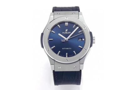A classic watch with a blue dial, silver case, and blue strap, featuring luminous hands and markers.
