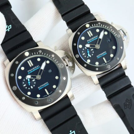 Two black wristwatches with blue accents and black straps placed side by side.