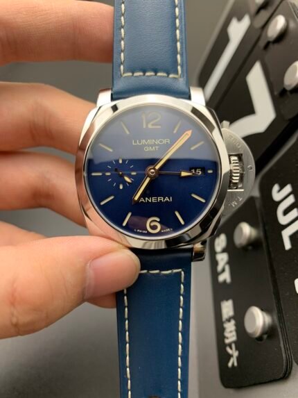 A blue wristwatch with white markers on a blue strap.