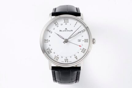 A wristwatch with a white dial, silver case, and black leather strap.