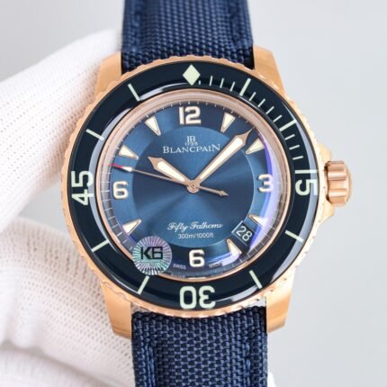 A watch with a gold case, blue dial, and black strap, featuring white numerals and hands.