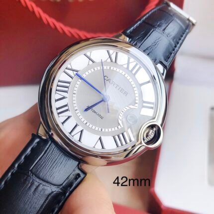 A 42mm stainless steel watch with a white dial and black leather strap.