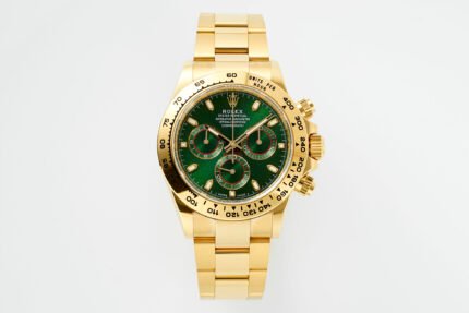 A gold wristwatch with a green dial and gold bracelet.