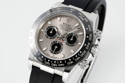 A silver wristwatch with a black dial and multiple sub-dials on a black strap.