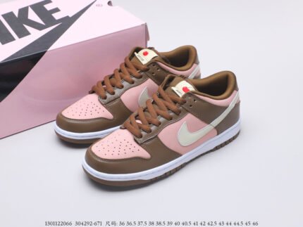 Pink and brown Nike Dunk Low sneakers with a pink shoebox.