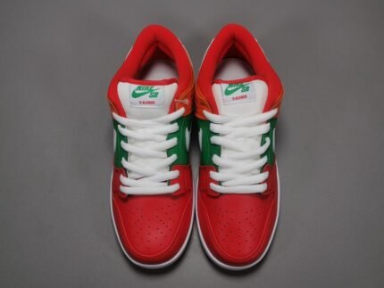 A pair of red, green, and white Nike Dunk Low sneakers with 'NIKE SB' and '7-ELEVEN' logos on the tongue.