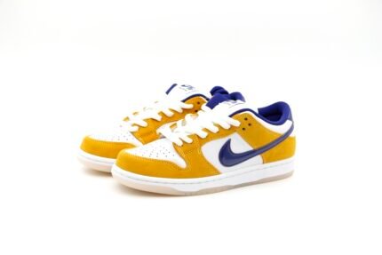 Yellow and blue Nike Dunk Low sneakers on a white background.