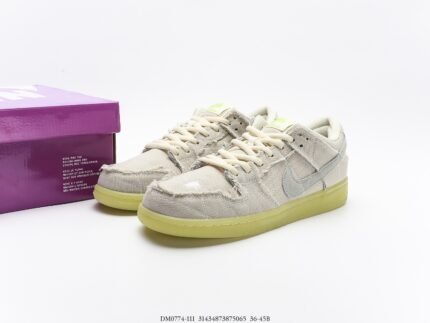 Beige and gray Nike Dunk Low sneakers with a purple shoebox.