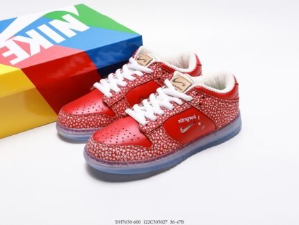 Red Nike Dunk Low sneakers with white speckles and a colorful shoebox.