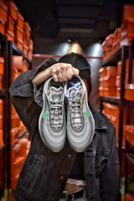 Gray sports shoes with colorful accents and transparent air cushion sole