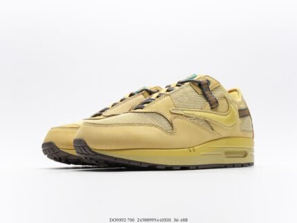 Yellow sports shoes with multicolored laces and air cushion design