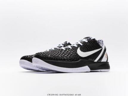 A pair of black sports shoes with white laces and a white sole