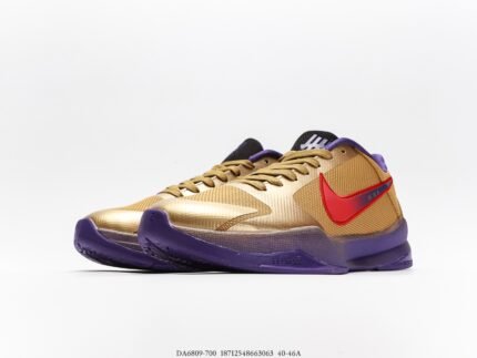 A pair of gold and purple sports shoes with black laces and a transparent air cushion