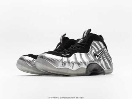 A pair of silver sports shoes with black laces and a transparent air cushion