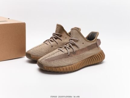 The image features a pair of light brown sneakers with a Primeknit upper that ensures great breathability and a comfortable fit. The laces are of the same color as the upper, contributing to a minimalist and contemporary design. The outsole is made of rubber in a matching color and has a distinctive pattern designed for good cushioning and traction. These shoes are suitable for casual everyday wear and light sports activities, making them a versatile choice due to their stylish appearance and comfortable wear experience.
