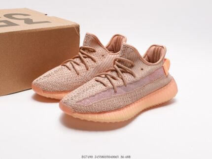 The image displays a pair of light brown sneakers with a Primeknit upper that offers excellent breathability and comfort. The laces are color-coordinated with the upper, and the overall design is simple and elegant. The sole is translucent light brown, complementing the upper and featuring Boost technology, which is highly regarded for its superior cushioning and energy return. These shoes are not only suitable for sportswear but also for casual daily wear, making them an ideal choice with their stylish appearance and comfortable fit.