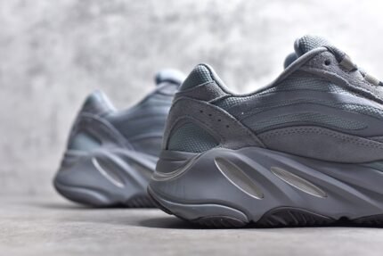 Grey sneakers with a modern design and streamlined silhouette