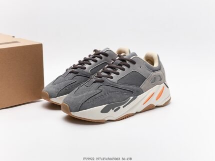 Grey sneakers with orange accents